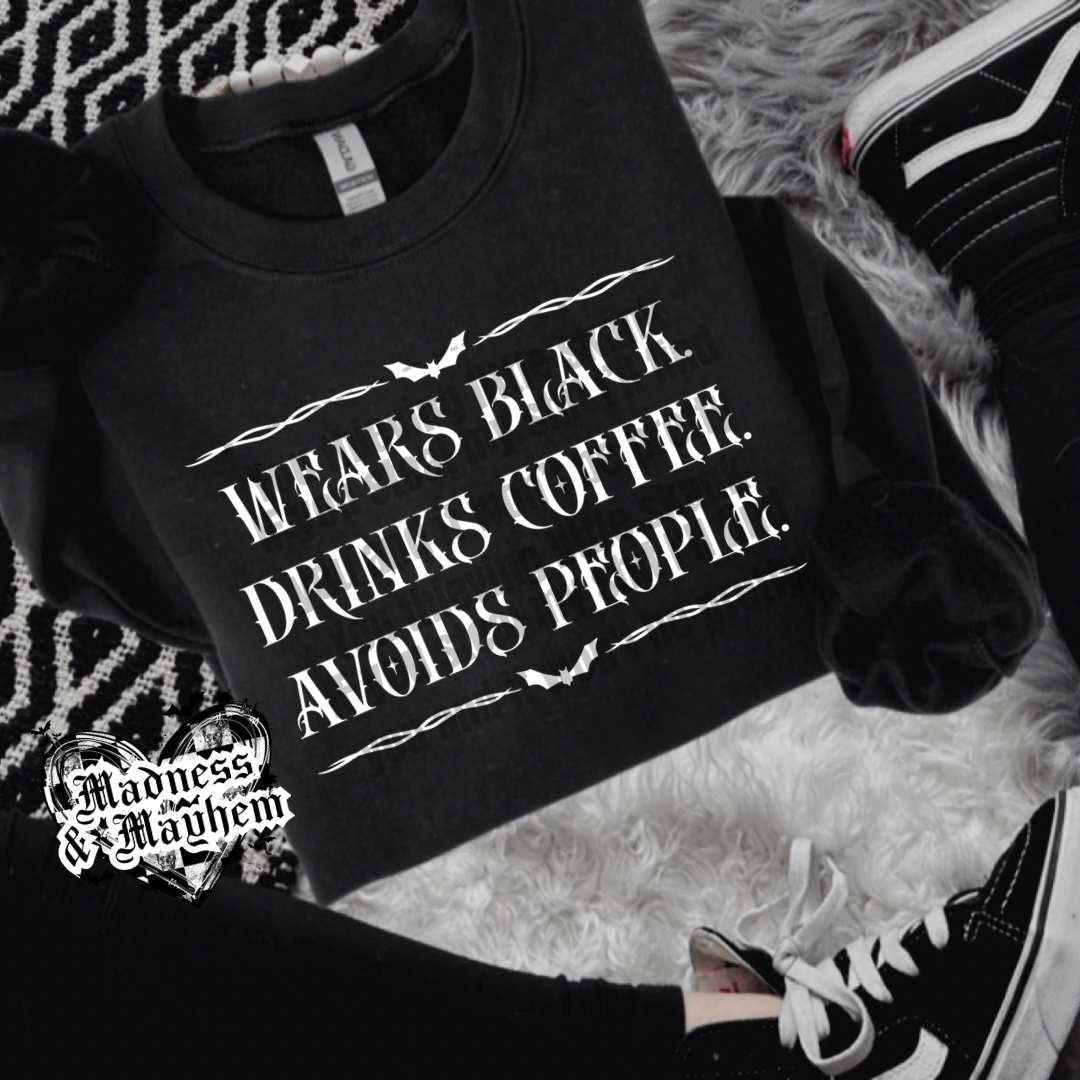 Wears black crew neck sweatshirt